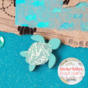 Laura Rumble scrapbook layout with StickerKitten Mermaid Treasures craft papers
