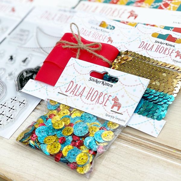 Dala Horse Christmas Craft Bundle - Cardmaking Kit by StickerKitten - closeup of embellishments - sequins, sequin trim and red ribbon