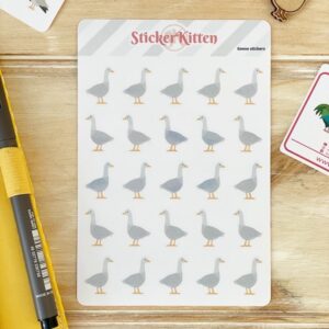A sheet of geese stickers on a wooden board