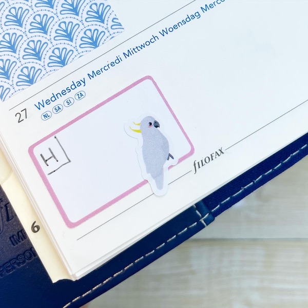 Cockatoo sticker on a planner page