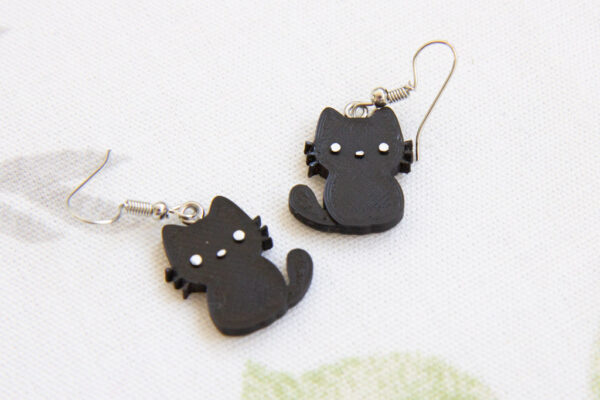 Cute halloween black cat earrings close up