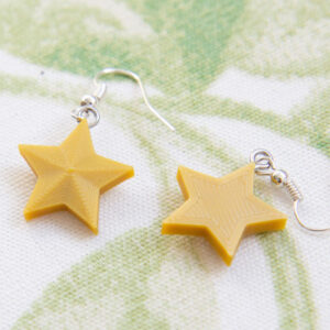 3D-printed gold star christmas earrings front and back