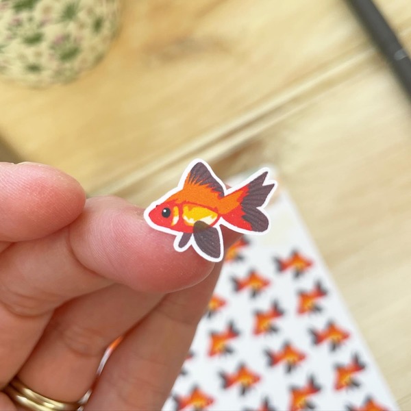 close up of a cute goldfish sticker