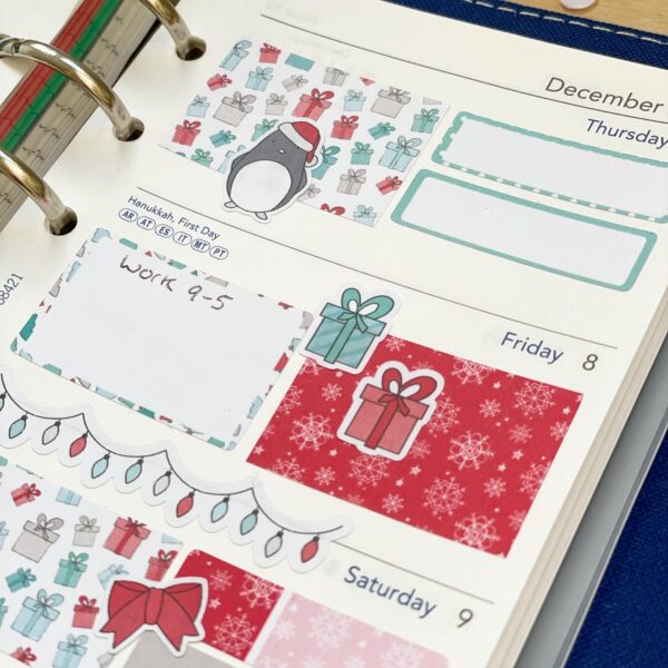 filofax planner page close up featuring cute penguins christmas planner stickers
