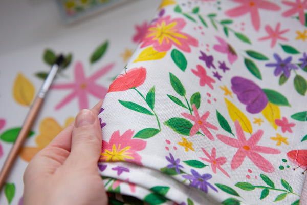 Close up of painted floral tea towel