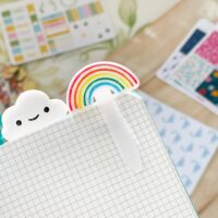 Closeup of cute rainbow planner clip showing hand-painted details