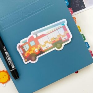 Fire Engine sticker on the front of a planner
