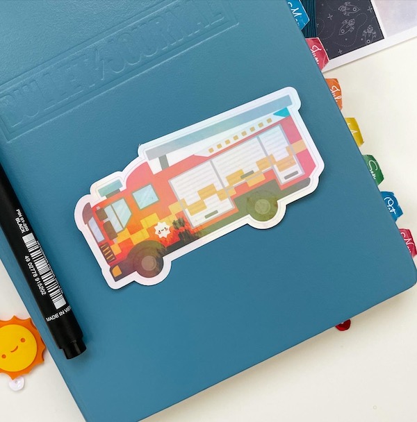 Fire Engine sticker on the front of a planner