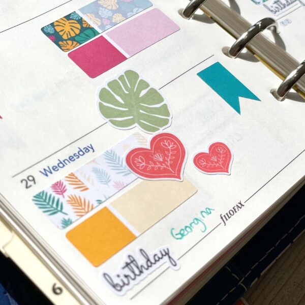 Folk heart stickers on planner page