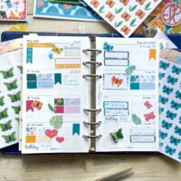 Filofax planner page spread with tropical Jungle theme and butterfly stickers