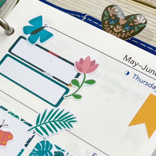 Pink tulip sticker on a planner page