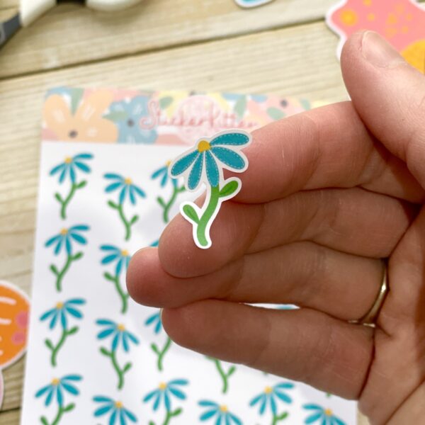 Blue daisy planner sticker close up