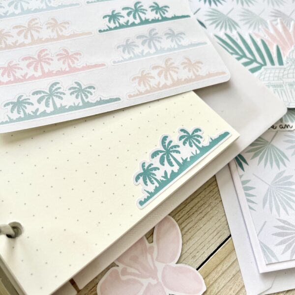 Dot grid journal page with palm tree stickers