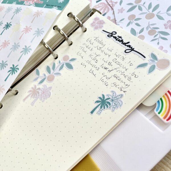 Dot grid journal page with palm tree stickers