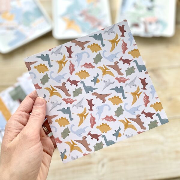 Cute tumbling dinosaurs patterned paper designed and made by StickerKitten UK