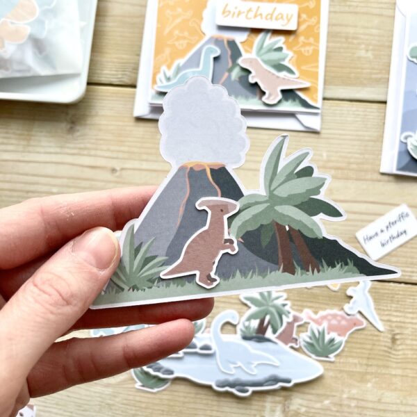 Parasaurolophus and volcano cardmaking toppers - cut from 280gsm card. Designed and made in the UK by StickerKitten.