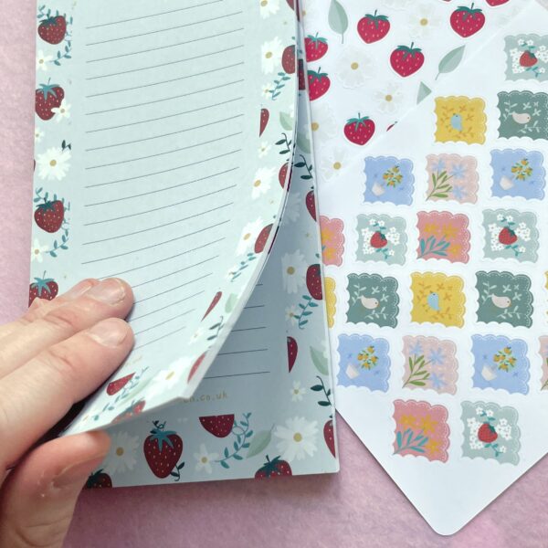 Close up of strawberry DL notepad to do list